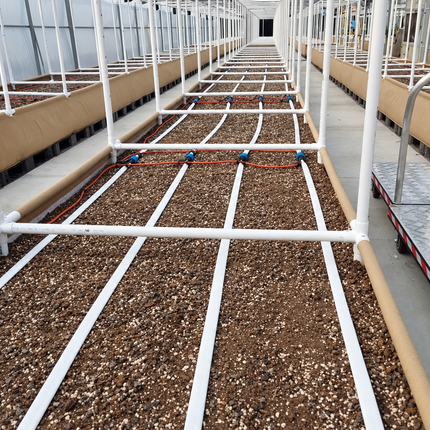 Gravity BluSoak white tape in a raised bed