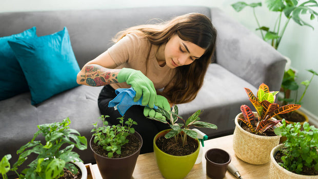Woman gardening at home with tattoo on arm